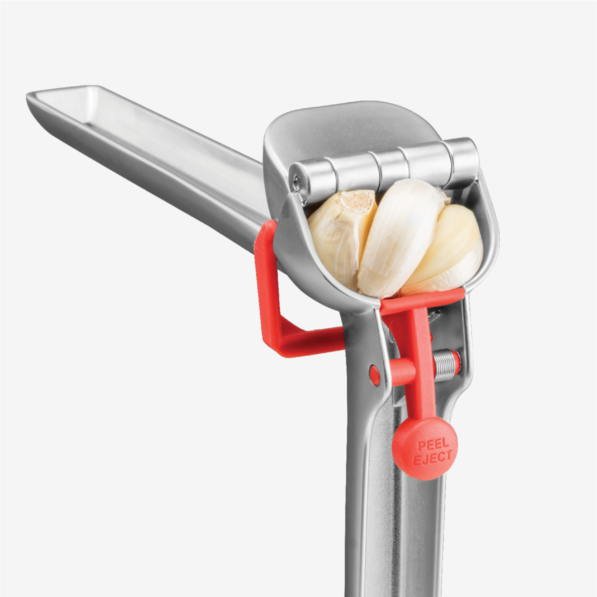 Premium Garlic Press in Red loaded with garlic