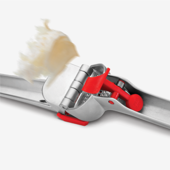 Premium Garlic Press in Red ejecting a peel